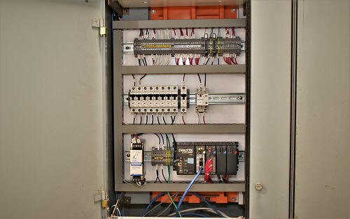 Inside a typical retrofitted PLC panel.