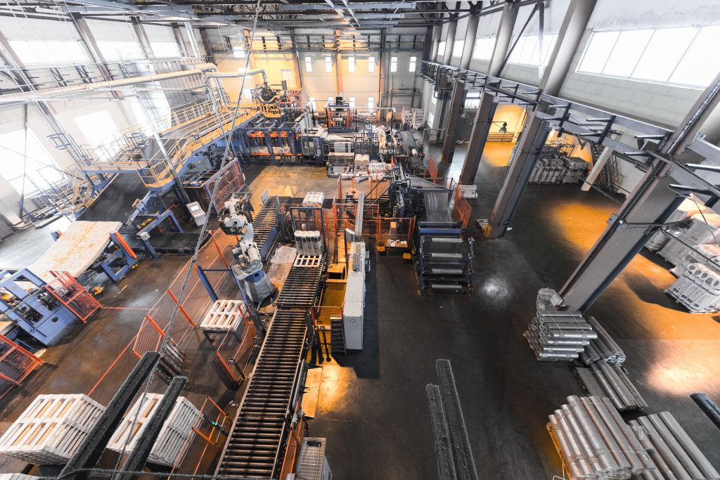 Top view of modern operational plant producing fiberglass heavy industry machinery metalworking workshop concept.