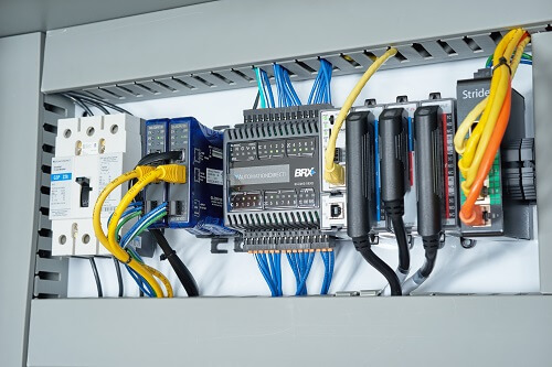 BRX PLC with additional ports using STRIDE Industrial Ethernet switch and a GS drive serial-to-Ethernet adapter. 